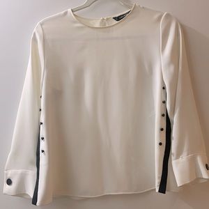 White Zara blouse with black details.